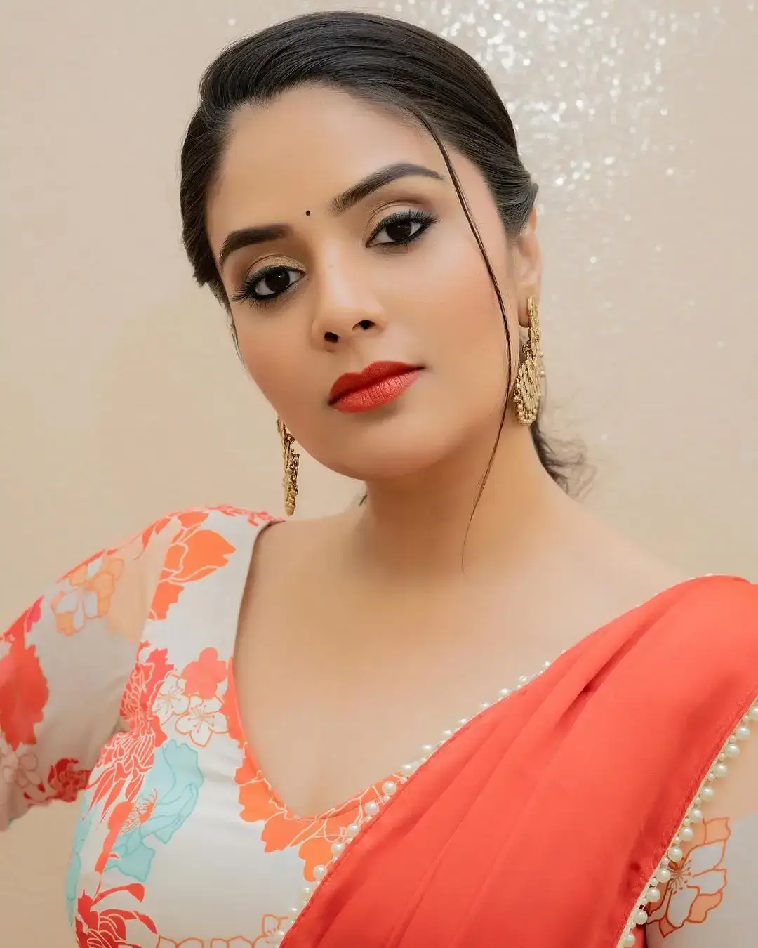 BEAUTIFUL INDIAN ACTRESS SREEMUKHI IN ORANGE LEHENGA CHOLI